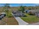 Attractive home with a well-manicured lawn, a long driveway, and a classic design at 225 Babson Dr, Babson Park, FL 33827