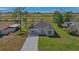 Charming single-story home with a well-maintained lawn and a long concrete driveway in a peaceful neighborhood at 225 Babson Dr, Babson Park, FL 33827