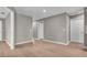 An interior hallway showcasing updated finishes and multiple doors, creating easy transitions at 225 Babson Dr, Babson Park, FL 33827