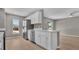 Bright kitchen equipped with stainless steel appliances, white cabinets, and bar seating at 225 Babson Dr, Babson Park, FL 33827