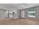 Open-concept living space showcasing new flooring, fresh paint and abundant natural light at 225 Babson Dr, Babson Park, FL 33827