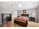 Charming bedroom featuring wooden furniture and a cozy bed at 225 Highgate Park Blvd, Davenport, FL 33897