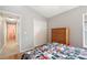 Bedroom features a closet and view to hallway at 225 Highgate Park Blvd, Davenport, FL 33897