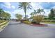 Welcome to Westgate Park, a gated community with lush landscaping, swaying palm trees, and secure entrance for peace of mind at 225 Highgate Park Blvd, Davenport, FL 33897