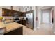 Well-equipped kitchen featuring stainless steel appliances and ample cabinet space at 225 Highgate Park Blvd, Davenport, FL 33897