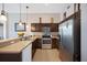 Modern kitchen with stainless steel appliances and ample counter space at 225 Highgate Park Blvd, Davenport, FL 33897