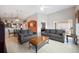 Open-concept living area featuring neutral walls, tile flooring, and access to the kitchen at 225 Highgate Park Blvd, Davenport, FL 33897