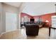 Comfortable living room featuring tile floors, neutral paint colors, and ample seating at 225 Highgate Park Blvd, Davenport, FL 33897