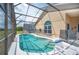 Screened-in pool and lanai with comfortable seating and beautiful backyard view at 225 Highgate Park Blvd, Davenport, FL 33897