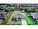 Aerial view of a single-Gathering home showcasing its landscaping and overall curb appeal at 238 Lake Eloise Pointe Blvd, Winter Haven, FL 33880