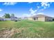 Spacious backyard featuring a storage shed and a well-maintained lawn at 238 Lake Eloise Pointe Blvd, Winter Haven, FL 33880