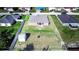 View of the backyard with the house, shed, and black fire pit at 238 Lake Eloise Pointe Blvd, Winter Haven, FL 33880