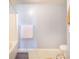 Bathroom showcasing a shower-tub combo and neutral-toned tile flooring at 238 Lake Eloise Pointe Blvd, Winter Haven, FL 33880