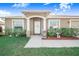 Inviting home entrance with landscaped yard and decorative details at 238 Lake Eloise Pointe Blvd, Winter Haven, FL 33880