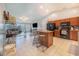 Open-concept kitchen with a large island, connecting to the living area with sliding doors at 238 Lake Eloise Pointe Blvd, Winter Haven, FL 33880