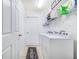 Laundry room with a washer, dryer, and plenty of storage at 238 Lake Eloise Pointe Blvd, Winter Haven, FL 33880