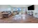 Bright living room with a plush sofa, decorative rug, and sliding glass doors at 238 Lake Eloise Pointe Blvd, Winter Haven, FL 33880