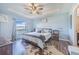 This bedroom features a tray ceiling, lots of natural light, and an ensuite bathroom at 238 Lake Eloise Pointe Blvd, Winter Haven, FL 33880