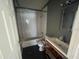 Bathroom featuring a toilet, shower and bathtub combo, and sink at 261 Acacia Walk, Lake Wales, FL 33898