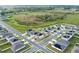 This aerial shows new homes in a Primary-planned community with picturesque natural surroundings at 271 Inman Blvd, Winter Haven, FL 33881