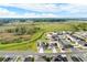A high aerial view depicts a residential neighborhood next to a large open field at 271 Inman Blvd, Winter Haven, FL 33881