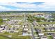 A wide aerial view shows a large residential neighborhood with streets and community landscape at 271 Inman Blvd, Winter Haven, FL 33881