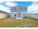 The backyard offers a well maintained lawn and privacy fence at 271 Inman Blvd, Winter Haven, FL 33881
