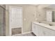 Bathroom featuring a double vanity and a walk-in closet at 271 Inman Blvd, Winter Haven, FL 33881