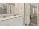 Well-lit bathroom with double sink vanity and access to the shower and bedroom at 271 Inman Blvd, Winter Haven, FL 33881