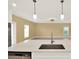 Bright kitchen featuring pendant lighting, stainless steel appliances, and an undermount sink at 271 Inman Blvd, Winter Haven, FL 33881