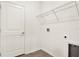 Laundry room featuring storage racks and tile floor at 271 Inman Blvd, Winter Haven, FL 33881