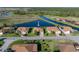 Aerial perspective of a single-Gathering home situated on a lot with a pond view in a well-kept neighborhood at 3014 Ashton Palms Dr, Lake Wales, FL 33859