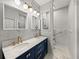 Elegant bathroom boasting double sinks, a marble countertop, and a separate toilet room at 3014 Ashton Palms Dr, Lake Wales, FL 33859