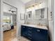 Bathroom with a dual sink vanity, walk-in shower, and view into the bedroom at 3014 Ashton Palms Dr, Lake Wales, FL 33859