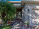 Charming front entrance with brick walkway, double doors, and lush landscaping at 3014 Ashton Palms Dr, Lake Wales, FL 33859