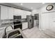 Modern kitchen with stainless steel appliances, sleek white cabinets, and granite countertops at 3014 Ashton Palms Dr, Lake Wales, FL 33859