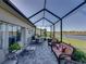 Spacious covered lanai with dining and seating areas, ideal for outdoor living at 3014 Ashton Palms Dr, Lake Wales, FL 33859
