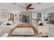 Bright living room with fireplace, TV, ceiling fan, and neutral decor, perfect for relaxing and entertaining at 3014 Ashton Palms Dr, Lake Wales, FL 33859