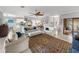 Open-concept living area with tile floors, comfortable seating, and seamless access to the kitchen and dining at 3014 Ashton Palms Dr, Lake Wales, FL 33859