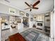 Open-concept living room features tile flooring, a fireplace, and seamless flow to other living spaces at 3014 Ashton Palms Dr, Lake Wales, FL 33859