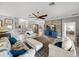 Comfortable living room with tile flooring, modern decor, and seamless transition to other areas of the house at 3014 Ashton Palms Dr, Lake Wales, FL 33859