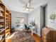 Bright office with built-in bookshelves, a large window, and a ceiling fan at 3014 Ashton Palms Dr, Lake Wales, FL 33859