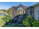A screened patio with comfortable seating, creating an inviting outdoor living space with a view of the lush landscaping at 3014 Ashton Palms Dr, Lake Wales, FL 33859