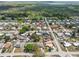 Aerial view of a residential area with single-Gathering homes surrounded by trees and nature at 319 Thomas Ave, Frostproof, FL 33843