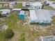 Aerial view showcasing the home's backyard and the surrounding neighborhood at 319 Thomas Ave, Frostproof, FL 33843