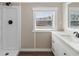 Modern bathroom featuring a shower, vanity, and bright natural light at 319 Thomas Ave, Frostproof, FL 33843