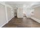 Light-filled bedroom with wood-look flooring, neutral walls, and ample closet space at 319 Thomas Ave, Frostproof, FL 33843