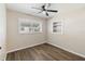 Cozy bedroom with vinyl floors, natural light from the window, and closet shelf at 319 Thomas Ave, Frostproof, FL 33843