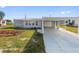 Charming single-story home with a carport and well-maintained front yard at 319 Thomas Ave, Frostproof, FL 33843