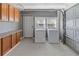 Convenient laundry area with washer, dryer, counter space and cabinets at 319 Thomas Ave, Frostproof, FL 33843